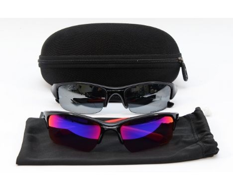 Two pairs of sport sunglasses and black case